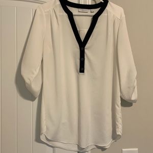 White v-neck blouse with black detailing